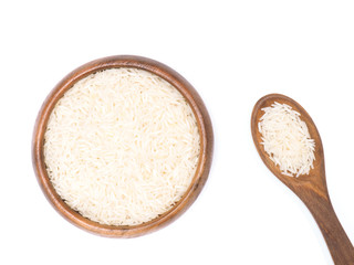 Fototapeta na wymiar Indian long grain Basmati rice in brown wooden bowl and spoon isolated on white. Indian cuisine, ayurveda, naturopathy concept