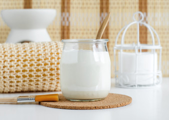Homemade greek yogurt facial mask in the glass jar. Diy natural beauty treatment recipe. Copy space