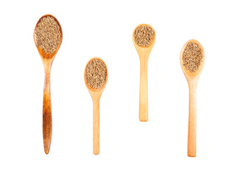 Set of spice cumin (jeera) in wooden spoon isolated on white