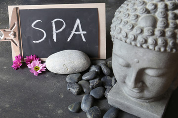 buddha head with stones , flowers and tabular