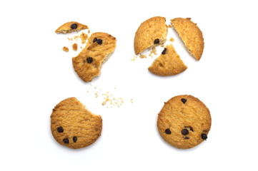 Chocolate chip cookies and crumble cracks on white background. Sweet biscuits delicious and crunchy homemade pastry.
