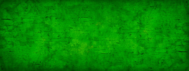 Abstract green grunge background. Toned old stained wood background. Green vintage banner. Copy...