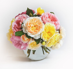 Bouquet of flovers  on white background. Roses on glass round vase, celebration concept