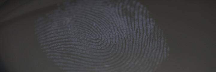 Fingerprint mark on clear glass as crime evidence