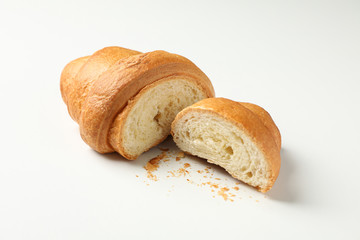 Freshly baked croissant on white background, close up