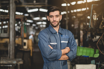 Confident engineers and handsome people are confident and successful in standing jobs in industrial environments.