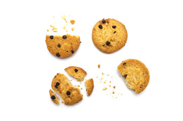 Chocolate chip cookies and crumble cracks on white background. Sweet biscuits delicious and crunchy homemade pastry.