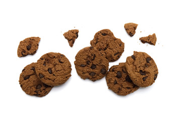 Chocolate chip cookies with some broken and crumbs on white background in Top view.