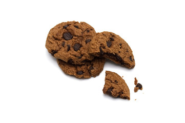 Chocolate chip cookies with some broken and crumbs on white background.
