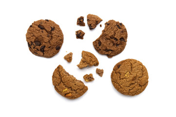 Chocolate chip cookies and crumbs on white background and Top view.