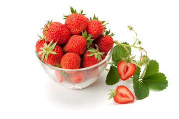 Fresh strawberries in a glass vase.