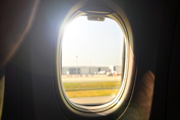Fototapeta na wymiar The airplane window is travelling 