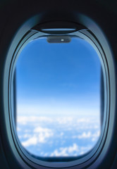 The airplane window is travelling on sky