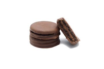 Chocolate sandwich cookies filled and coated with chocolate cream isolated on white background.