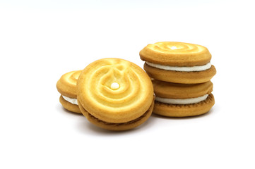 Sandwich cookies with coconut cream flavor on white background. Stack of crunchy biscuits delicious sweet meal and useful cracker. Tasty sweet snack.