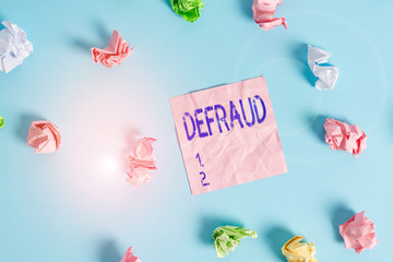Handwriting text Defraud. Conceptual photo to trick or cheat someone or something in order to get...
