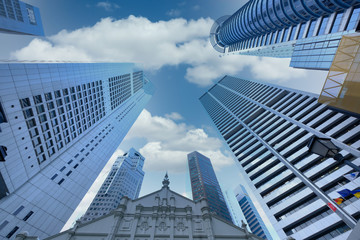 low angle view of singapore financial buildings at sunny day