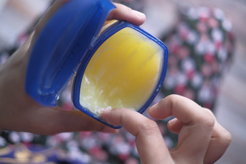 top view of young women use Vaseline for caring health 