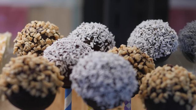Healthy Raw Energy Balls On Sticks Coated With Chocolate.