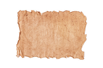 Flat lay sheet of blank ancient shabby torn paper or parchment isolated on a white background.