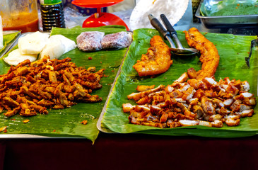 Roast pork that is cooked on the stove has a sweet and delicious flavor, eaten with sticky rice, is a popular snack in Thailand