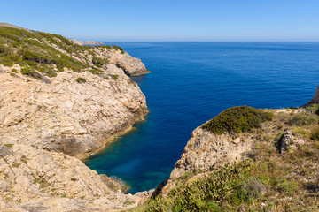 Fototapeta na wymiar Rocky coast with blue sea. North-east coast of Majorca. Spain