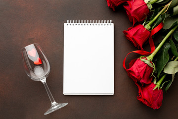 Valentines day assortment with roses and empty notepad
