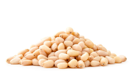 Pile of pine nuts close-up on a white. Isolated