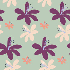 Flat seamless floral pattern in vector. Spring lilies of purple, orange and beige isolated on a green background