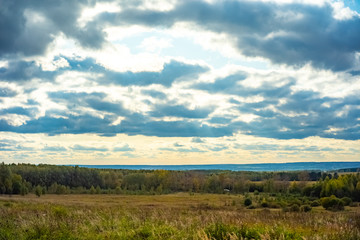 Obraz premium Beautiful clouds in autumn day in the forest near Moscow - nature of Russia.
