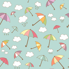 Obraz premium Multicolored umbrellas seamless pattern with clouds in the sky. Cute wallpaper, kids background. Vector illustration in cartoon style