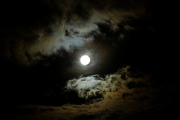 Obraz na płótnie Canvas Full Moon, Snow Moon with billowing clouds
