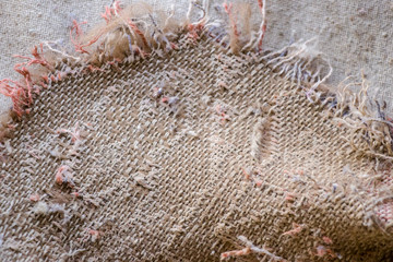 Old burlap and batting. Protruding threads. Conceptual background for design.