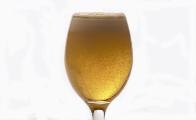 Beer into transparent glass, froth and bubbles
