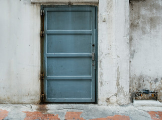 Fototapeta na wymiar Steel door used to open and wall background