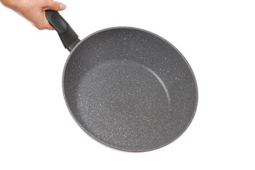 a pan in hands on a white background