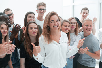 group of young people supporting their happy leader