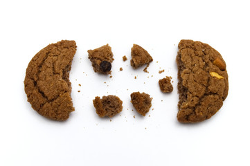 Biscuit with chocolate chip flavored. Some broken and crumbs of crunchy delicious sweet meal and useful cookie with on white background.