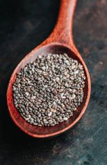 Chia seeds on the wooden table. Selective focus. shallow depth of field.