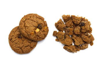 Biscuit with chocolate chip flavored. Some broken and crumbs of crunchy delicious sweet meal and useful cookie with on white background.