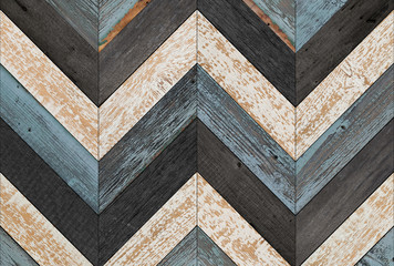 Vintage wooden wall with chevron pattern made of barn boards. Old weathered wood texture for background.  