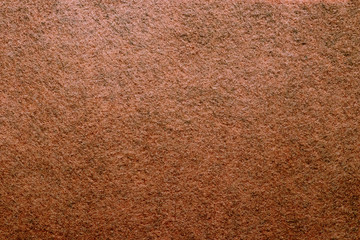 Abstract background with brown texture, velvet fabric, close-up. Colorful felt texture for background with copy space. Felt fabric sheet