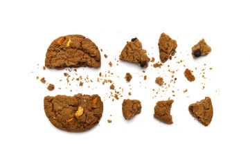 Biscuit with chocolate chip flavored. Some broken and crumbs of crunchy delicious sweet meal and useful cookie with on white background.