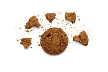 Biscuit with chocolate chip flavored. Some broken and crumbs of crunchy delicious sweet meal and useful cookie with on white background.