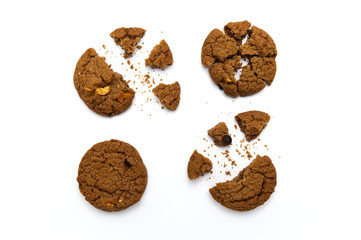 Biscuit with chocolate chip flavored. Some broken and crumbs of crunchy delicious sweet meal and useful cookie with on white background.