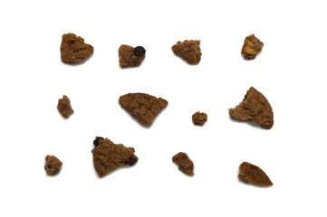 Cookies with chocolate chip flavored. Some broken and crumbs of crunchy delicious sweet meal and useful biscuits. Isolated on white background.