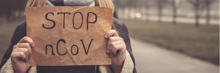 MERS-CoV Chinese infection Corona Virus masked girl on the background of the city in smog, the concept of the epidemic of the virus in China coronavirus nCov