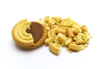 Sandwich cookies filled with coffee cream flavored. Some broken and crumbs of crunchy delicious sweet meal and useful cookie on white background.