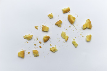 Sandwich cookies filled with coffee cream flavored. Some broken and crumbs of crunchy delicious sweet meal and useful cookie on white background.
