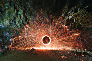Burning metallic wool light graphics highlighting empty cave